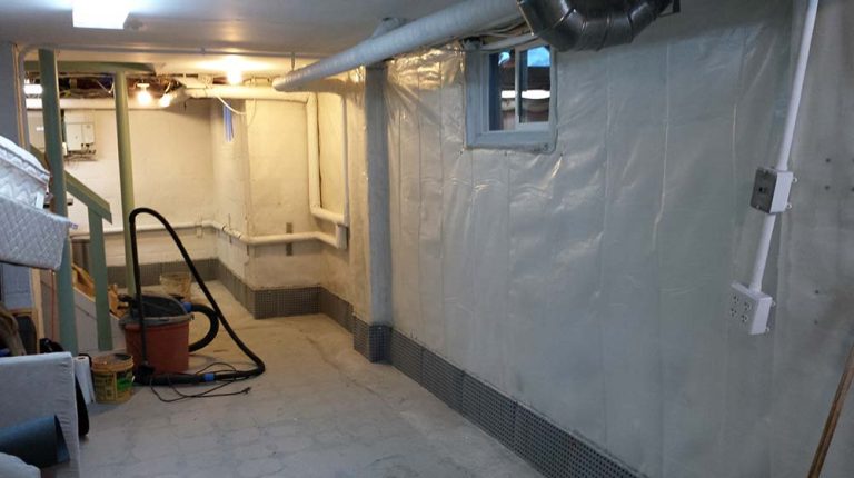 French Drain is complete, poly membrane on wall