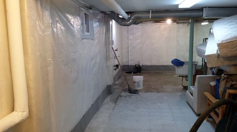 French Drain is complete, poly membrane on wall